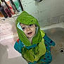 Greyson is registered to the contest to win money with this photo: bath, bathroom, bathtub, blue_eyes, child, clothing, dinosaur_towel, drain, expression, face, hooded_towel, indoor, plumbing, skin, standing, tiles, toddler, toiletries, water, wet