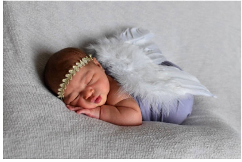 Sahara joined the competition — help win amazing prizes! baby, baby_sleeping, baby_toddler_clothing, cap, child, comfort, costume_hat, fashion_accessory, flooring, foot, fur, happy, headband, headpiece, linens, pattern, person, portrait_photography, sitting, toddler