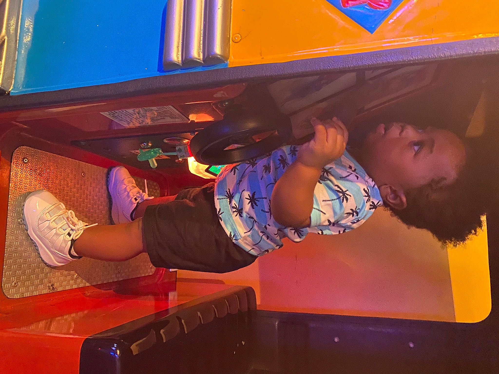 Quincy joined the competition — help win amazing prizes! art, automotive_design, automotive_exterior, electric_blue, entertainment, fun, human_leg, leisure, machine, magenta, motor_vehicle, orange, person, purple, recreation, room, t_shirt, thigh, toddler, vehicle_door