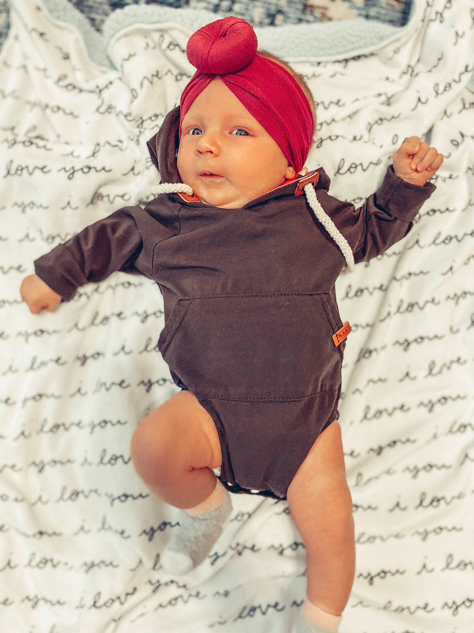 Indigo is registered to the contest to win money with this photo: baby, baby_toddler_clothing, child, clothing, headgear, joint, leg, pattern, person, pink, product, sleeve, toddler