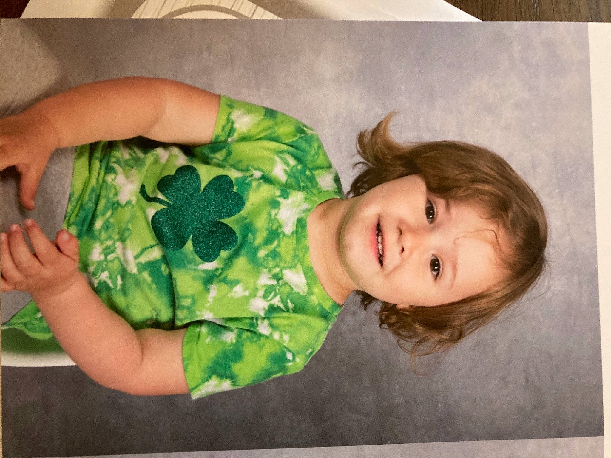 Kaisley is registered to the contest to win money with this photo: baby, baby_toddler_clothing, cheek, child, comfort, eye, fun, grass, happy, human_body, joy, linens, pattern, person, portrait_photography, room, skin, sleeve, smile, t_shirt