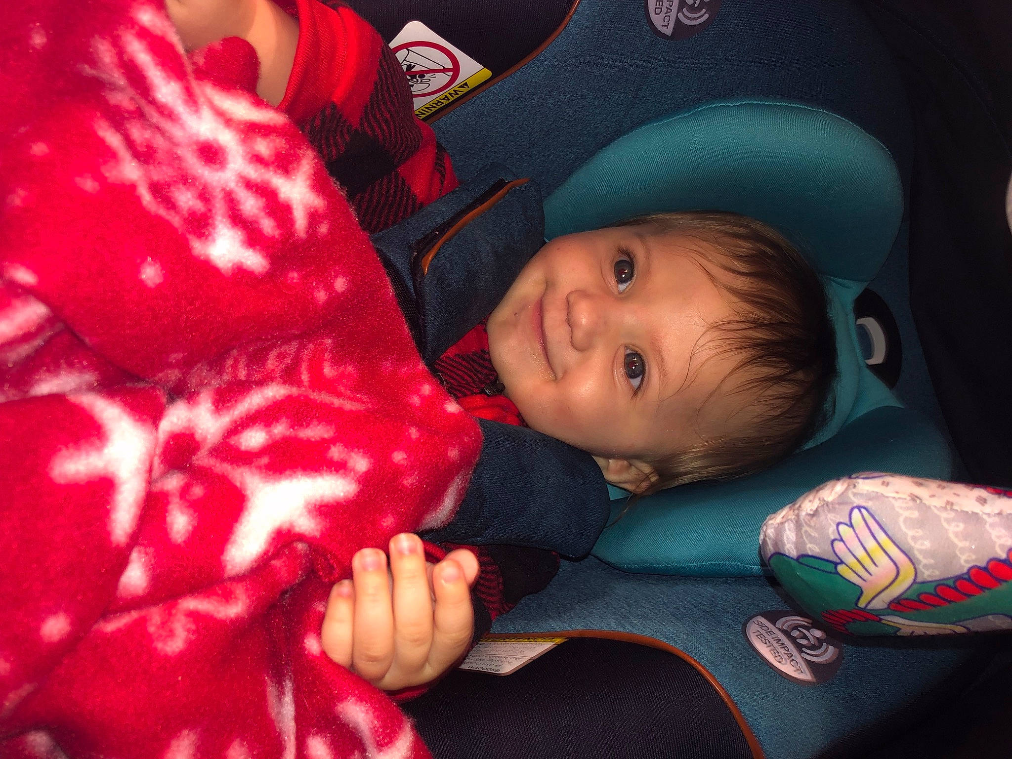 Kaliyah is registered to the contest to win money with this photo: arm, baby, child, comfort, event, facial_expression, finger, flash_photography, fun, gesture, happy, joy, lap, mammal, mouth, pattern, person, room, sitting, smile