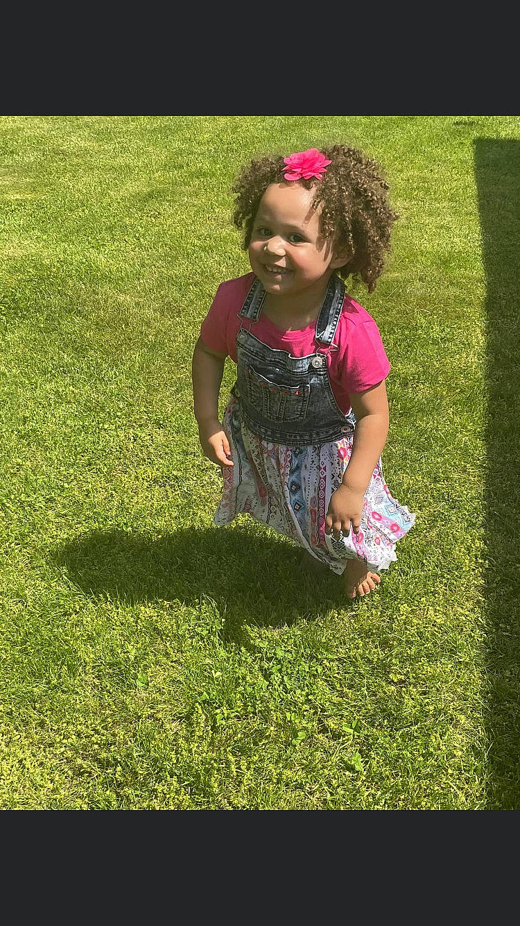 Jenamiah joined the competition — help win amazing prizes! baby_toddler_clothing, barefoot, child, fun, gesture, grass, grass_family, grassland, hair, happy, joy, lawn, leaf, leisure, meadow, people_in_nature, person, plant, recreation, smile