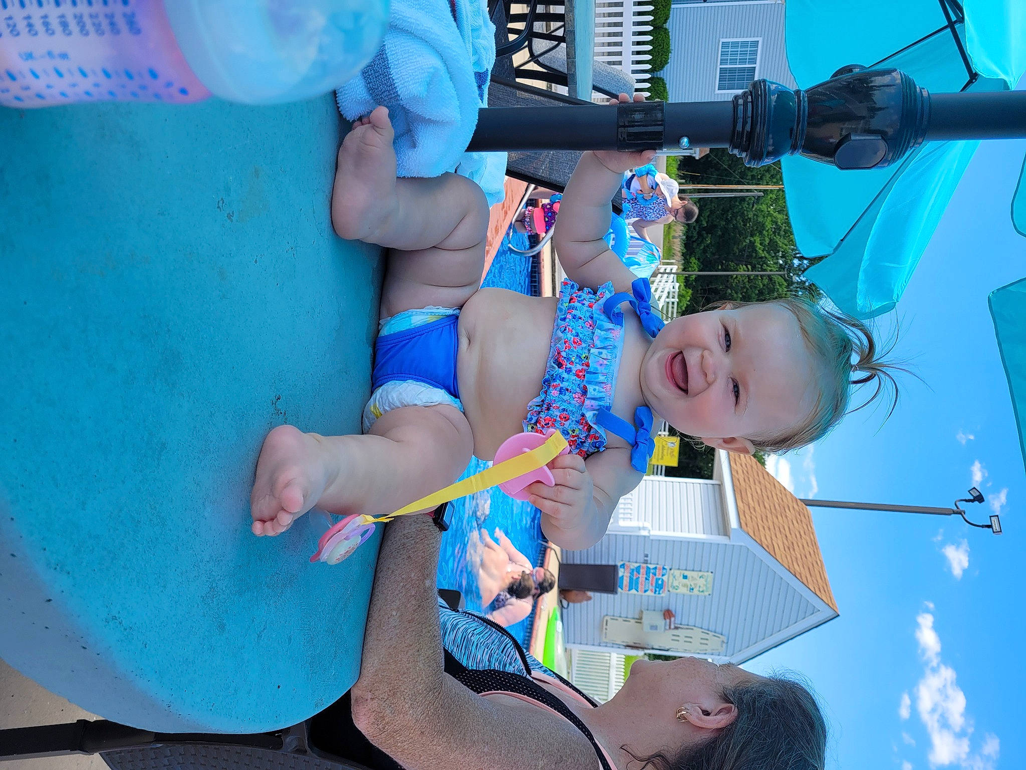 Addyson is registered to the contest to win money with this photo: azure, baby, blue, child, elbow, electric_blue, fun, happy, human_leg, knee, leisure, person, play, recreation, shorts, sky, smile, snapshot, thigh, toddler