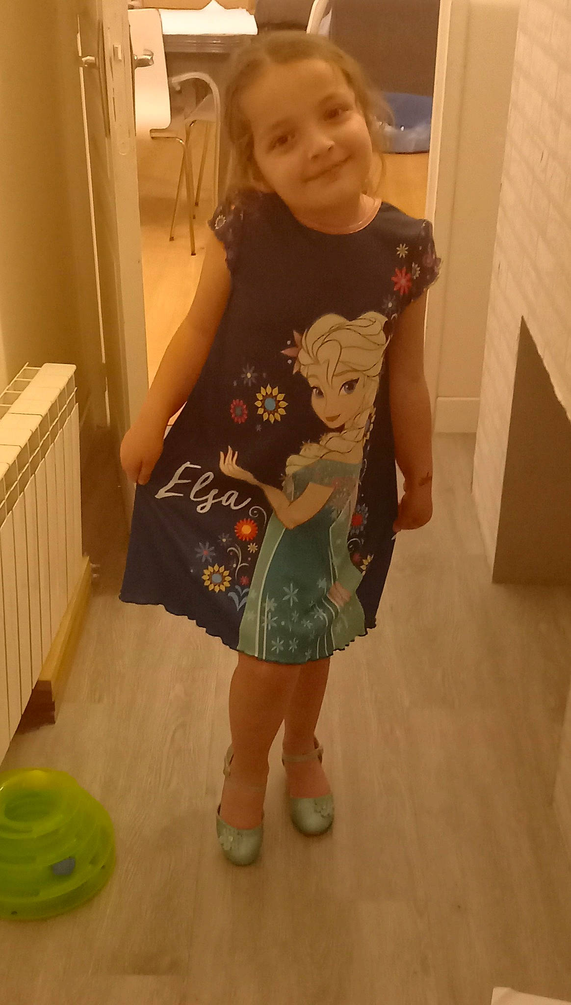 Heather participe au concours pour gagner de l'argent avec cette photo : baby_toddler_clothing, child, floor, flooring, fun, hairstyle, hardwood, joint, joy, knee, leg, neck, person, skin, sleeve, smile, standing, t_shirt, thigh, toddler