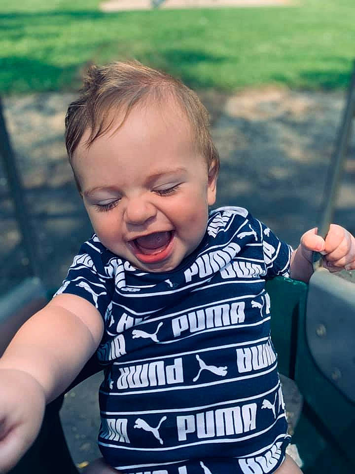 Kylar is registered to the contest to win money with this photo: baby_toddler_clothing, eye, face, facial_expression, finger, flash_photography, gesture, grass, hairstyle, hand, happy, head, human, human_body, iris, mammal, mouth, person, skin, sleeve