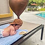 baby, infant, cap, balloon, heart_shaped, towel, lounge_chair, poolside, outdoor, milestone, wooden_sign, three_months, cute, child, skin, diaper, relaxing, sunny, daytime, focus
