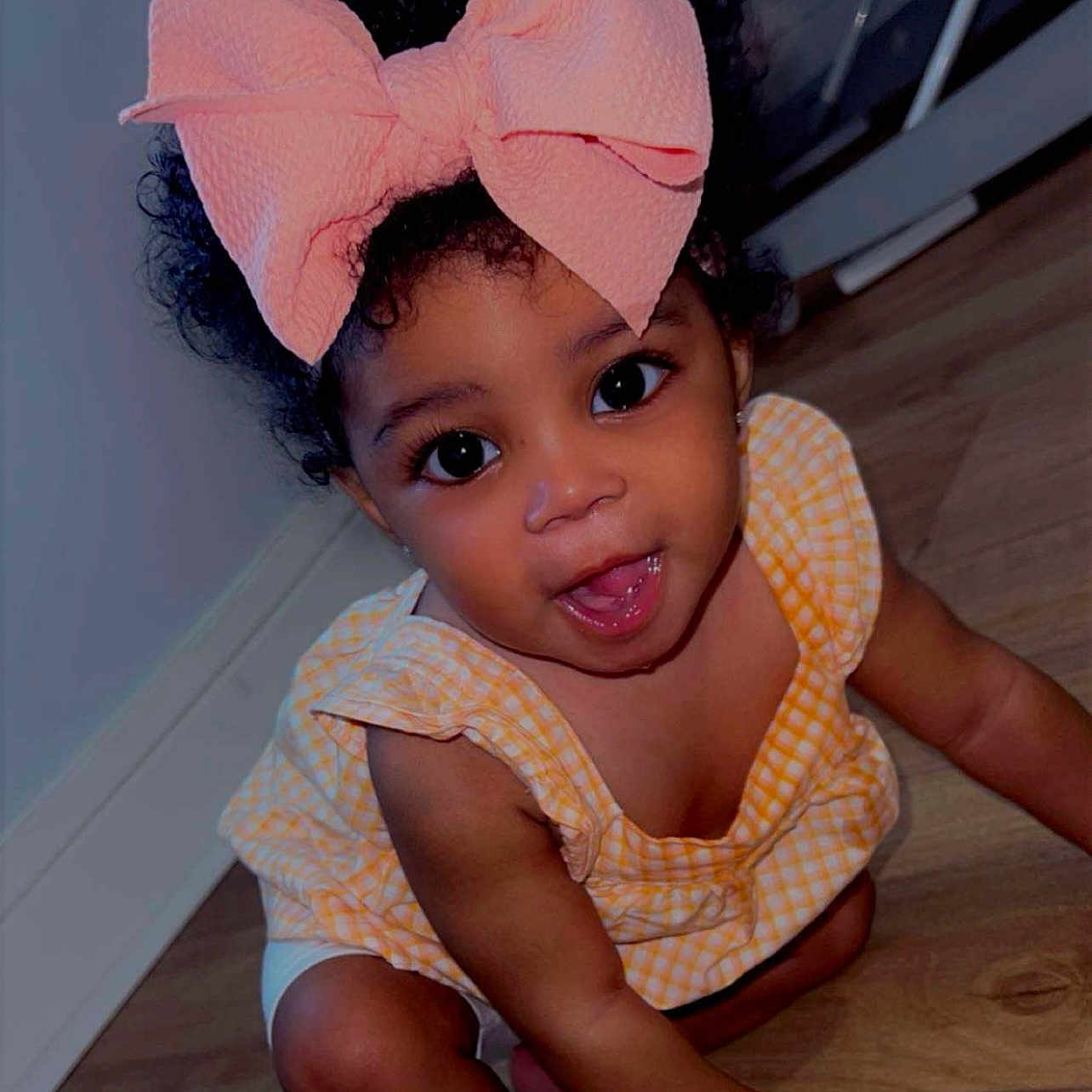 Promise joined the competition — help win amazing prizes! baby, bow, child, crawling, curly_hair, cute, eyes, floor, hand, happy, head, indoors, infant, legs, person, portrait, skin, smiling, toddler, yellow_dress