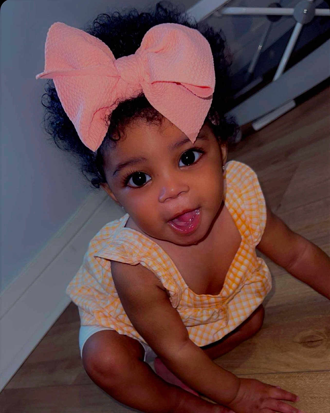 Promise joined the competition — help win amazing prizes! toddler, child, baby, bow, curly_hair, yellow_dress, crawling, floor, indoors, smiling, happy, cute, portrait, skin, eyes, hand, legs, infant, head, person