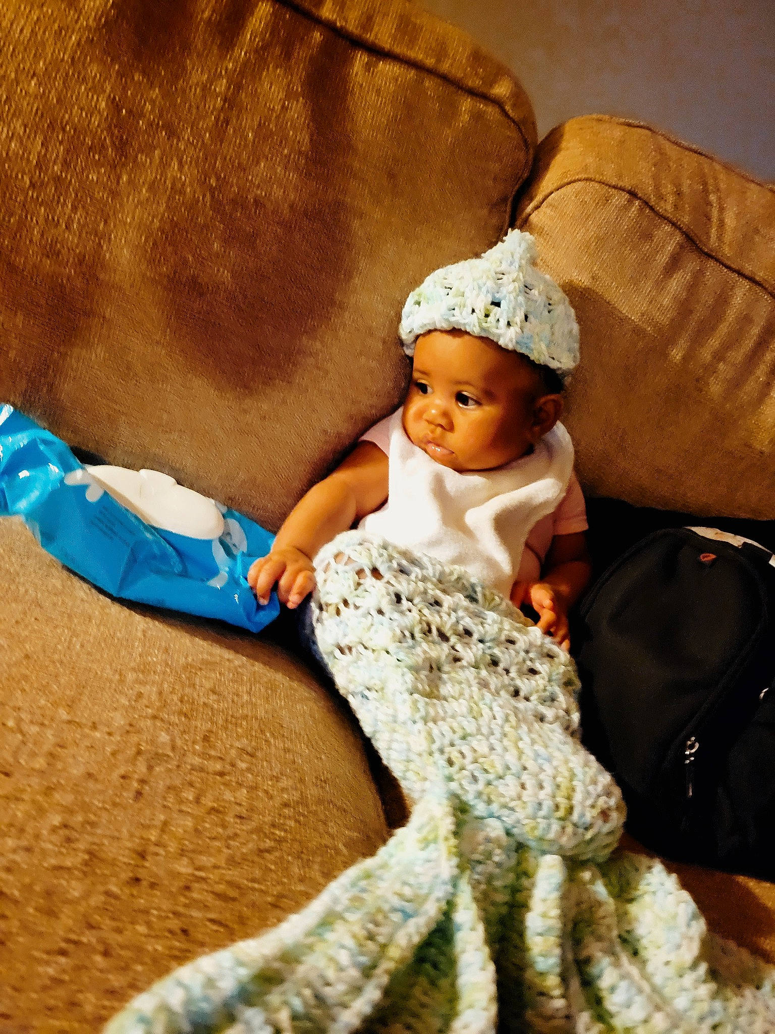 Jaelynn joined the competition — help win amazing prizes! baby, baby_toddler_clothing, child, comfort, doll, dress, fashion_accessory, fashion_design, flooring, gown, happy, headgear, headpiece, headwear, linens, luggage_and_bags, person, sitting, skin, textile