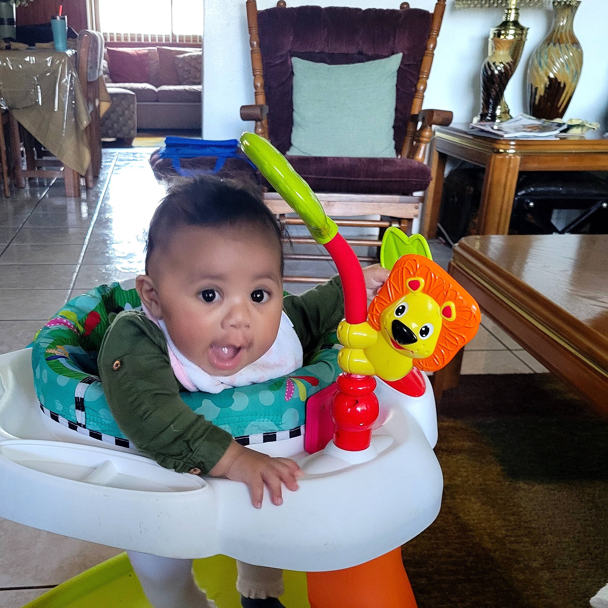 Jaelynn joined the competition — help win amazing prizes! baby, baby_playing_with_toys, baby_products, baby_toddler_clothing, chair, child, comfort, fun, green, happy, leisure, person, picture_frame, product, sitting, snapshot, surprise, table, toddler, toy
