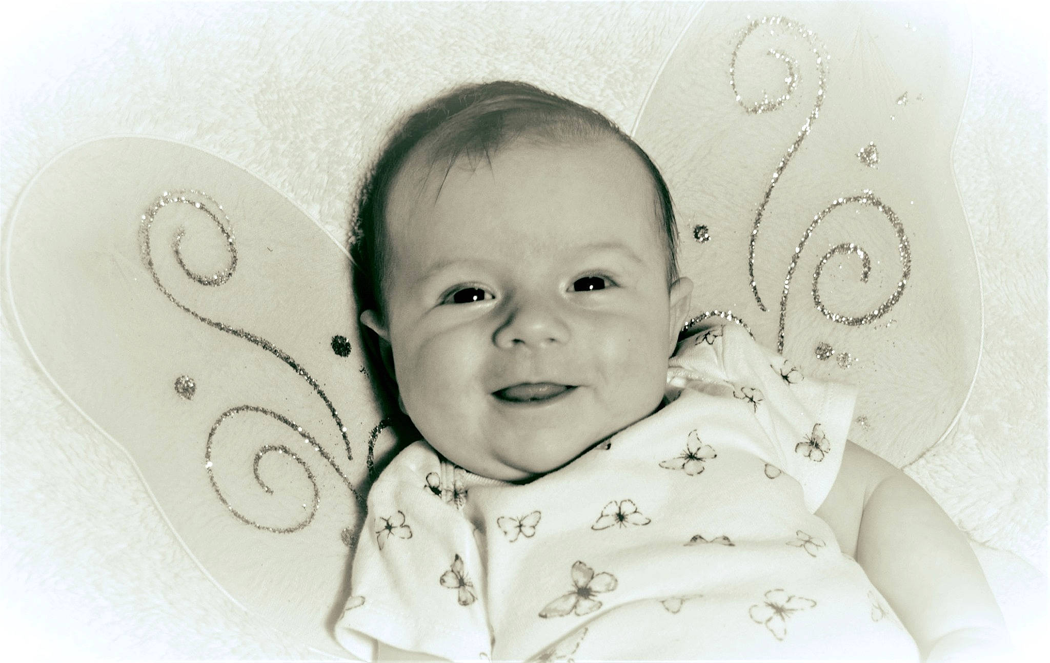 Riverlyn is registered to the contest to win money with this photo: baby, black_and_white, cheek, child, drawing, ear, face, facial_expression, happy, head, monochrome, nose, person, photograph, photography, skin, smile, stock_photography, style, toddler