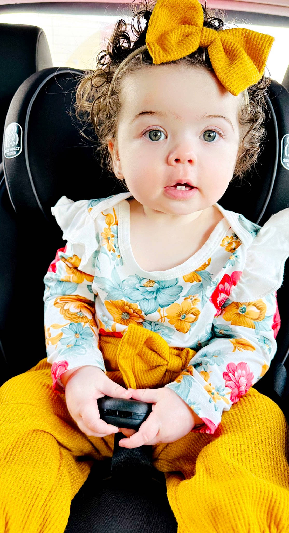 Harper is registered to the contest to win money with this photo: baby, baby_toddler_clothing, cap, cheek, child, costume_hat, dress, eye, fun, happy, hat, orange, organ, pattern, person, pink, sitting, skin, sleeve, toddler