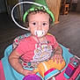 Sapphire joined the competition — help win amazing prizes! toddler, child, pacifier, curly_hair, green_hat, walker, toy, indoor, floor, plastic, colorful, bottle, clothing, person, baby, play, seat, cute, expression, young_child