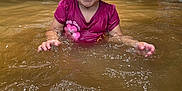 Sapphire joined the competition — help win amazing prizes! toddler, child, water, splashing, curly_hair, playful, outdoor, nature, forest, adults, relaxing, summer, muddy_water, toy, pink_shirt, person, recreation, happy, daytime, lake