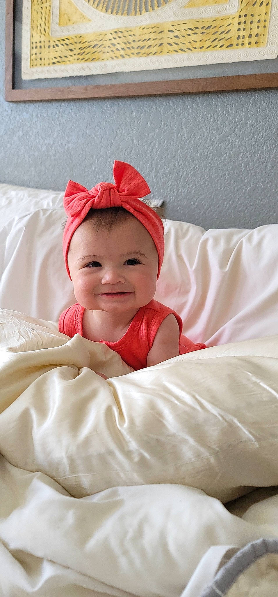 Camilla is registered to the contest to win money with this photo: baby, baby_laughing, baby_toddler_clothing, bedding, carmine, child, chin, comfort, face, fun, happy, headwear, joy, laugh, linens, lip, person, room, sleeve, smile
