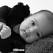 Ashley joined the competition — help win amazing prizes! baby, infant, black_and_white, close_up, face, hand, eyes, sweater, soft_texture, fluffy, portrait, lying_down, cute, child, newborn, skin, expression, monochrome, young, cozy
