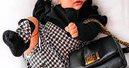 Ashley joined the competition — help win amazing prizes! baby, child, sunglasses, fashion, black_purse, houndstooth_pattern, headband, black_clothing, socks, portrait, cute, accessories, baby_fashion, white_background, posing, young_child, stylish, trendy, indoor, adorable
