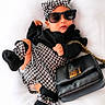 baby, child, sunglasses, fashion, black_purse, houndstooth_pattern, headband, black_clothing, socks, portrait, cute, accessories, baby_fashion, white_background, posing, young_child, stylish, trendy, indoor, adorable