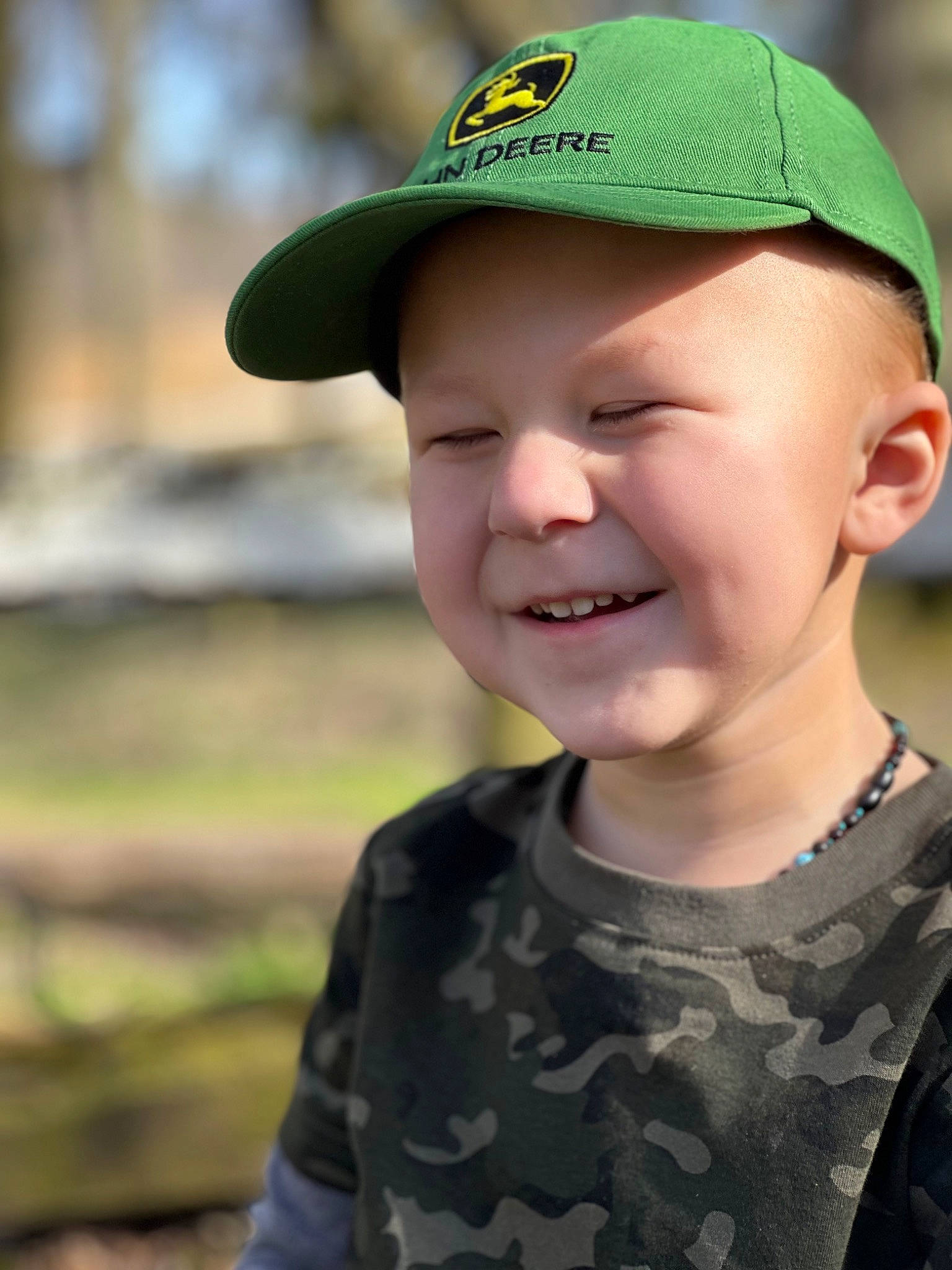 Ryker is registered to the contest to win money with this photo: baby, baby_toddler_clothing, baseball_cap, cap, cool, cricket_cap, electric_blue, eye, fun, grass, happy, hat, head, headwear, joy, lip, person, personal_protective_equipment, skin, sleeve