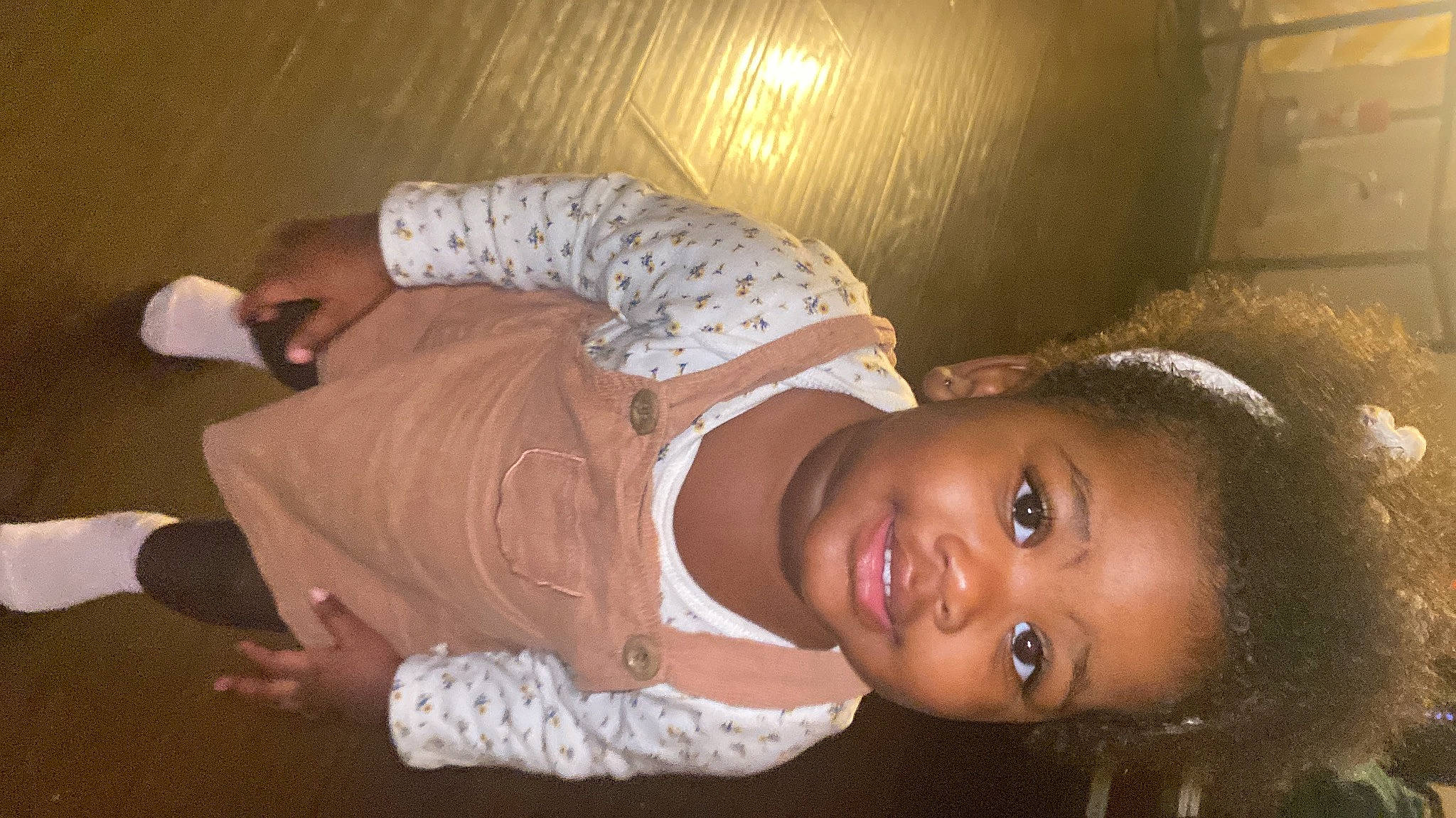 Ariyah is registered to the contest to win money with this photo: abdomen, baby_toddler_clothing, cheek, child, flash_photography, fun, happy, hat, joy, person, plant, room, smile, toddler, trunk, wood