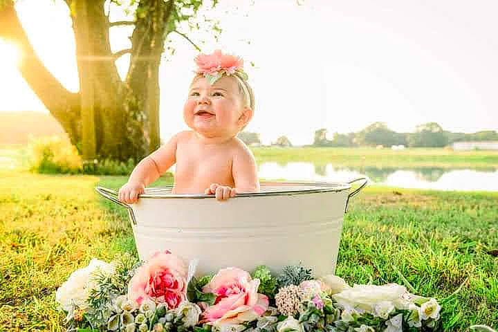 Evie joined the competition — help win amazing prizes! baby, child, flash_photography, flower, fun, grass, happy, headpiece, leisure, people_in_nature, person, petal, pink, plant, recreation, rose_family, sky, smile, summer, toddler