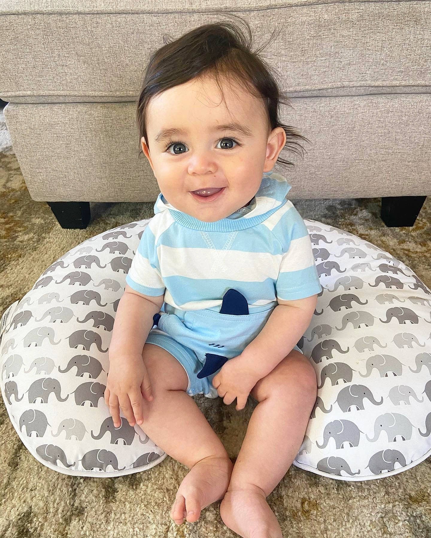 Joaquín joined the competition — help win amazing prizes! automotive_wheel_system, baby, baby_toddler_clothing, child, electric_blue, face, foot, fun, grass, happy, head, human_leg, joy, leisure, pattern, person, sitting, skin, sleeve, smile