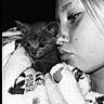 Scar joined the competition — help win amazing prizes! black_and_white, kitten, cat, person, face, blanket, cozy, snuggling, close_up, nose_ring, fur, soft_texture, portrait, affection, cuddle, young_person, animal, indoor, cute, intimate
