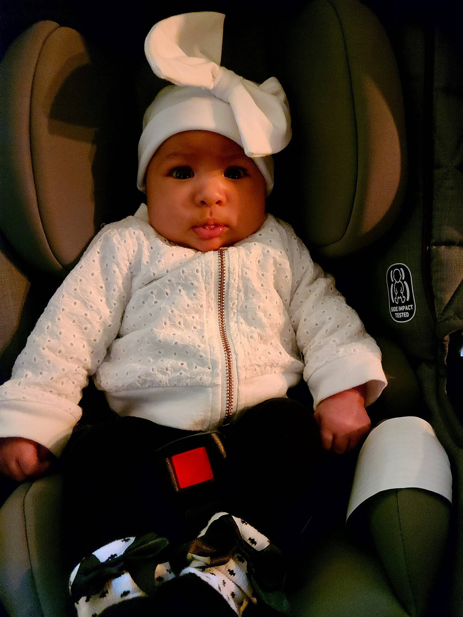 Rosalie is registered to the contest to win money with this photo: auto_part, baby, baby_products, baby_toddler_clothing, car_seat, car_seat_cover, chair, cheek, child, comfort, family_car, fun, head_restraint, headwear, human_leg, lap, person, product, seat_belt, sitting