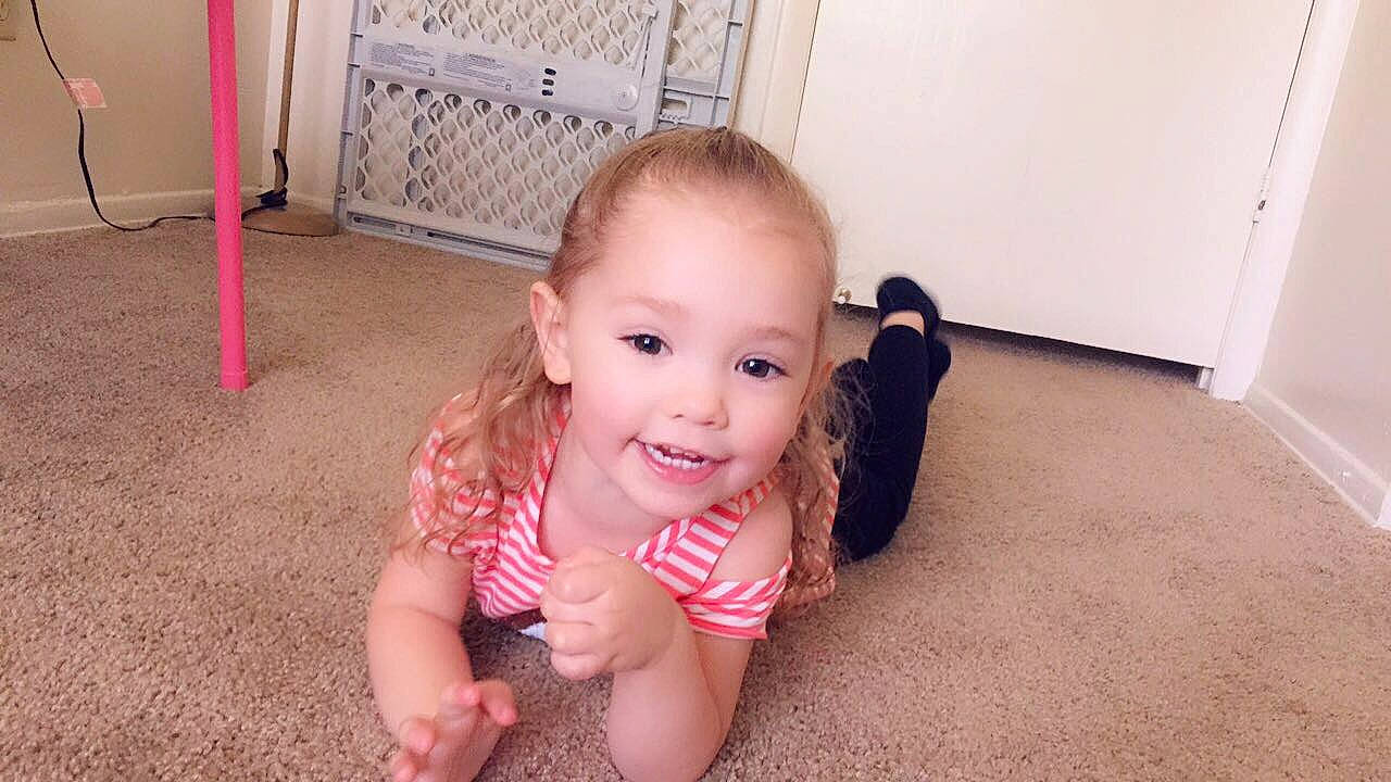 Kahlani is registered to the contest to win money with this photo: baby, cheek, child, crawling, eye, face, finger, floor, flooring, head, joy, leg, lip, mouth, nose, organ, person, pink, skin, smile