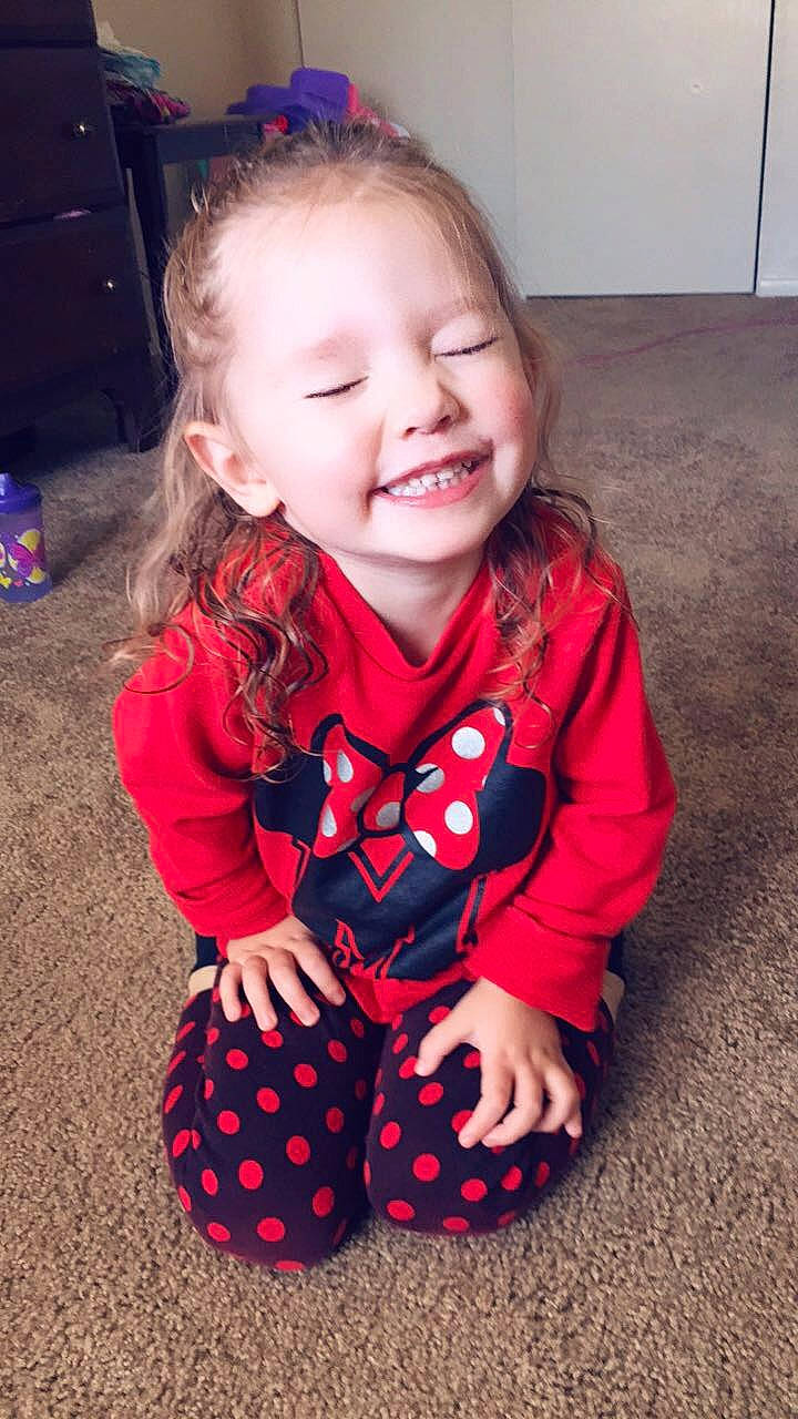 Kahlani is registered to the contest to win money with this photo: baby, baby_toddler_clothing, cheek, child, design, dress, face, facial_expression, head, iris, joy, outerwear, pattern, person, play, sitting, skin, sleeve, smile, toddler