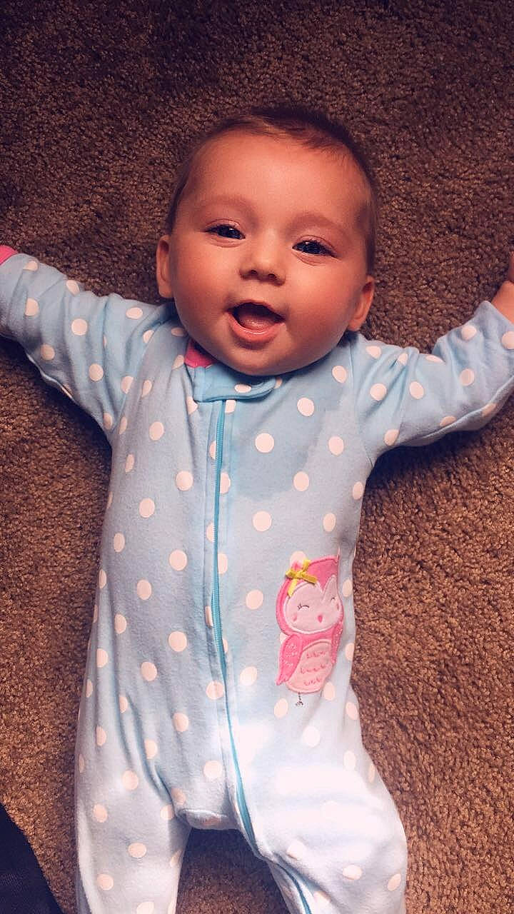 Avery is registered to the contest to win money with this photo: baby, baby_toddler_clothing, cheek, child, face, head, lip, person, pink, skin, smile, toddler