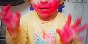 Amora joined the competition — help win amazing prizes! toddler, child, paint, red_paint, face_paint, hands, yellow_sweater, bird_design, blue_pants, sink, mirror, indoor, messy, playful, curly_hair, smiling, expression, person, home, cabinet
