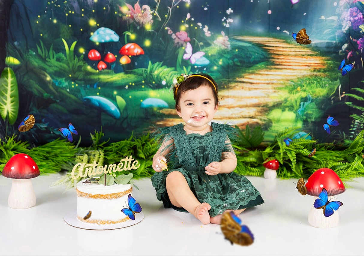 Antoinette joined the competition — help win amazing prizes! toddler, child, cake, birthday, dress, smile, mushroom, butterfly, greenery, forest_backdrop, celebration, happy, sitting, headband, party, fairytale, cake_smash, decorations, indoor, photography