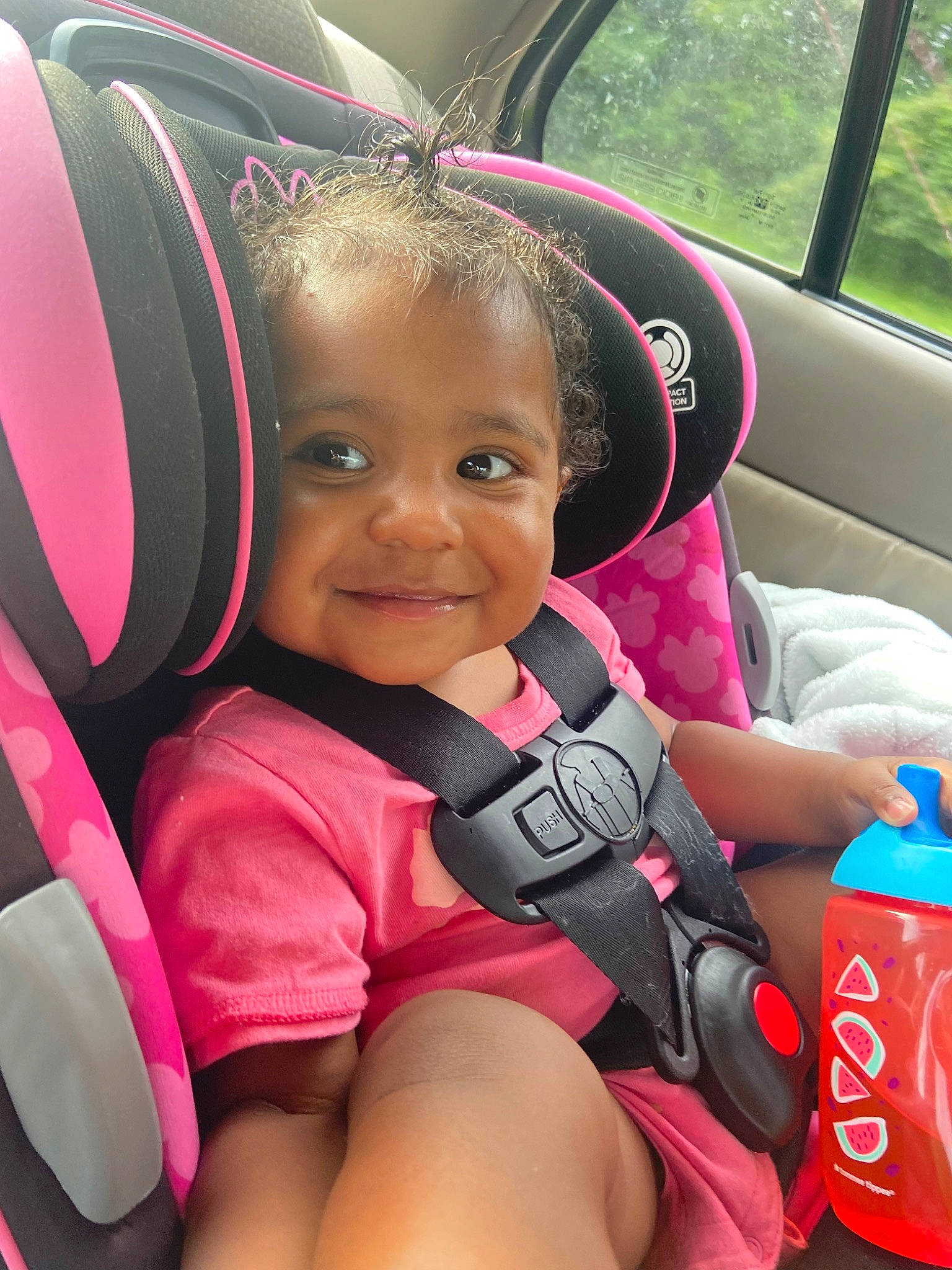 Iyanna joined the competition — help win amazing prizes! automotive_design, car, car_seat, car_seat_cover, comfort, cool, facial_expression, finger, happy, human, joy, motor_vehicle, person, pink, product, seat_belt, skin, smile, steering_part, steering_wheel