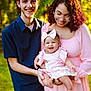 Emersyn joined the competition — help win amazing prizes! family, baby, smiling, woman, man, outdoor, nature, greenery, glasses, dress, bow, happy, child, parent, holding, portrait, sunlight, casual_clothing, grass, love