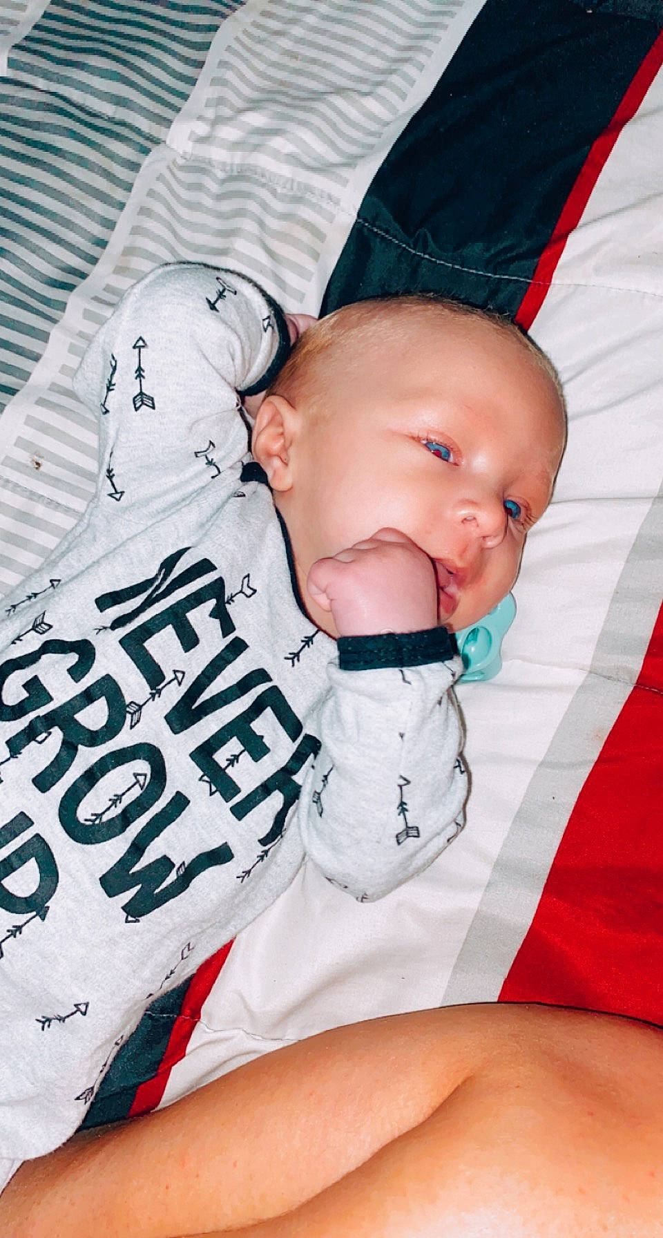 Eric is registered to the contest to win money with this photo: baby, baby_sleeping, baby_toddler_clothing, child, comfort, cool, finger, font, happy, mouth, nail, pattern, person, product, sleeve, textile, thigh, thumb, tie, toddler