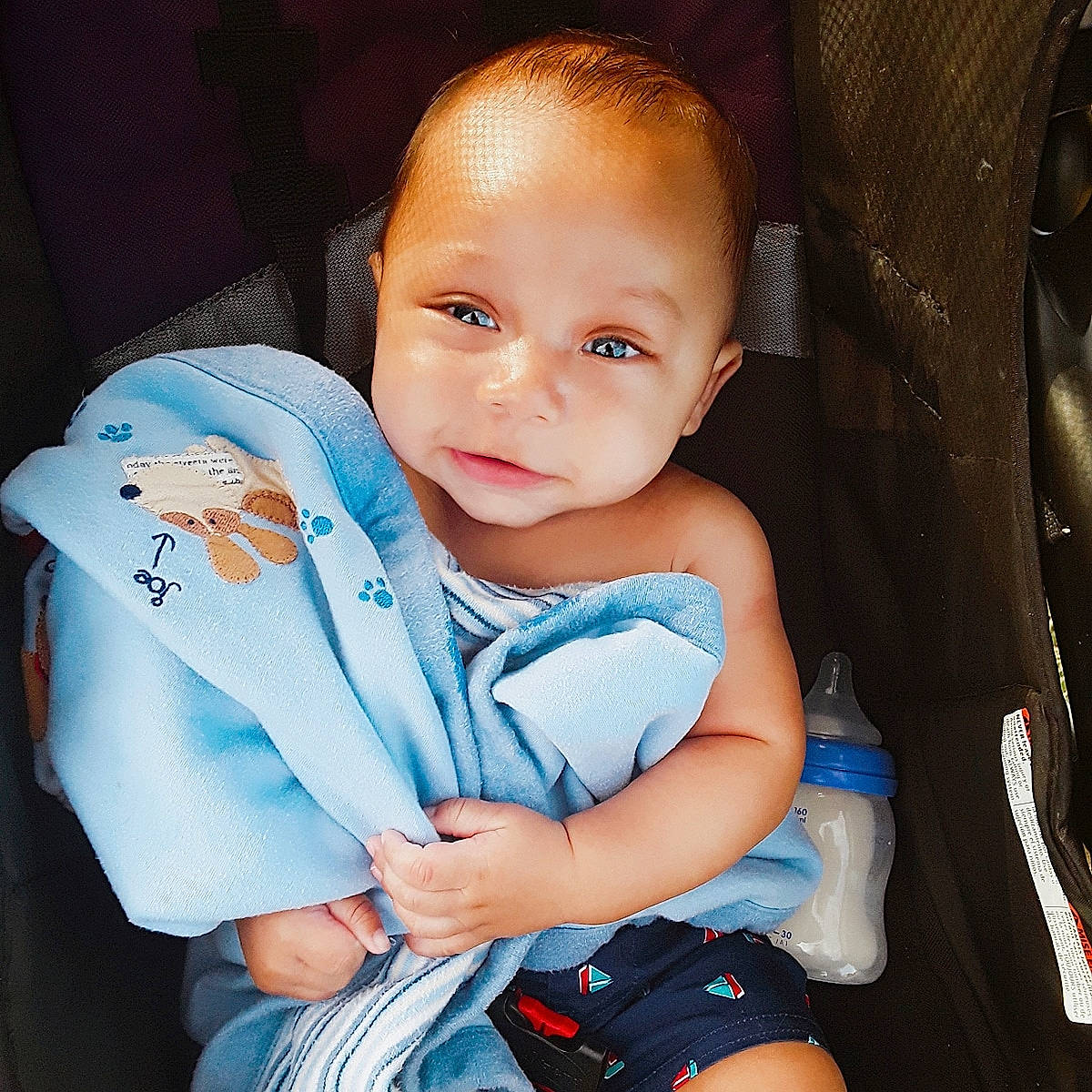 Duke joined the competition — help win amazing prizes! baby, baby_carriage, baby_products, beauty, blue, car_seat, cheek, child, cool, eye, face, finger, head, iris, lip, person, product, sitting, skin, smile