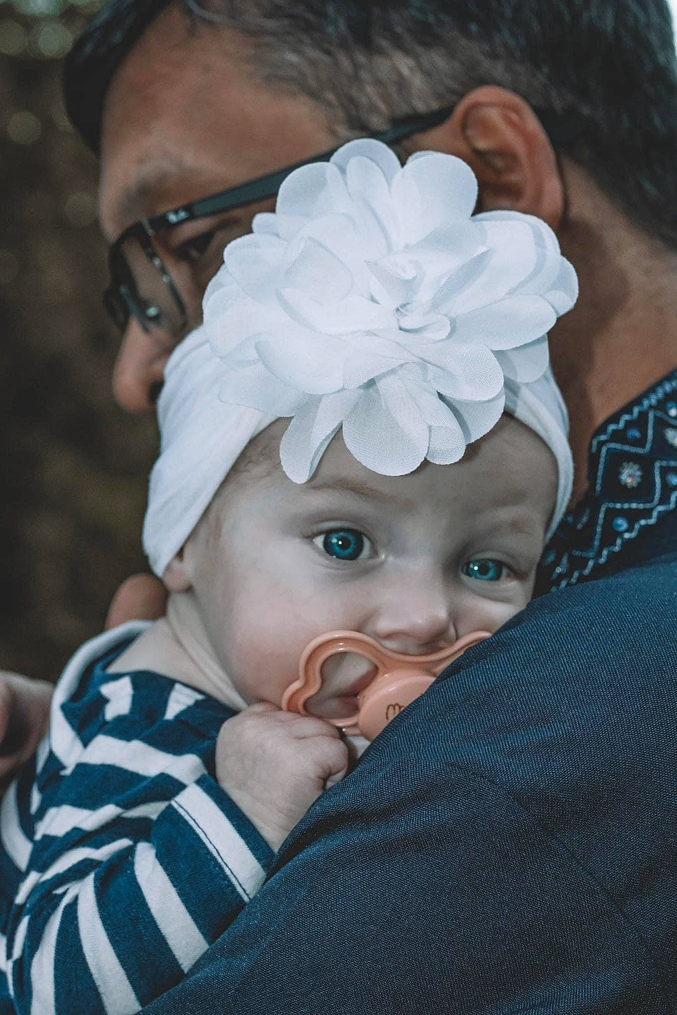 Kathryn is registered to the contest to win money with this photo: baby, baby_toddler_clothing, cheek, child, cool, eye, eyelash, fashion_accessory, forehead, hair, hair_accessory, happy, headband, headgear, headpiece, headwear, lip, organ, person, petal