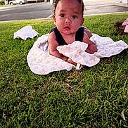 Jacob Woods is registered to the contest to win money with this photo: baby, child, infant, grass, outdoor, blanket, star_pattern, lying_down, portrait, face, curious, eyes, black_hair, park, lawn, street, gas_station, daylight, photography, safe