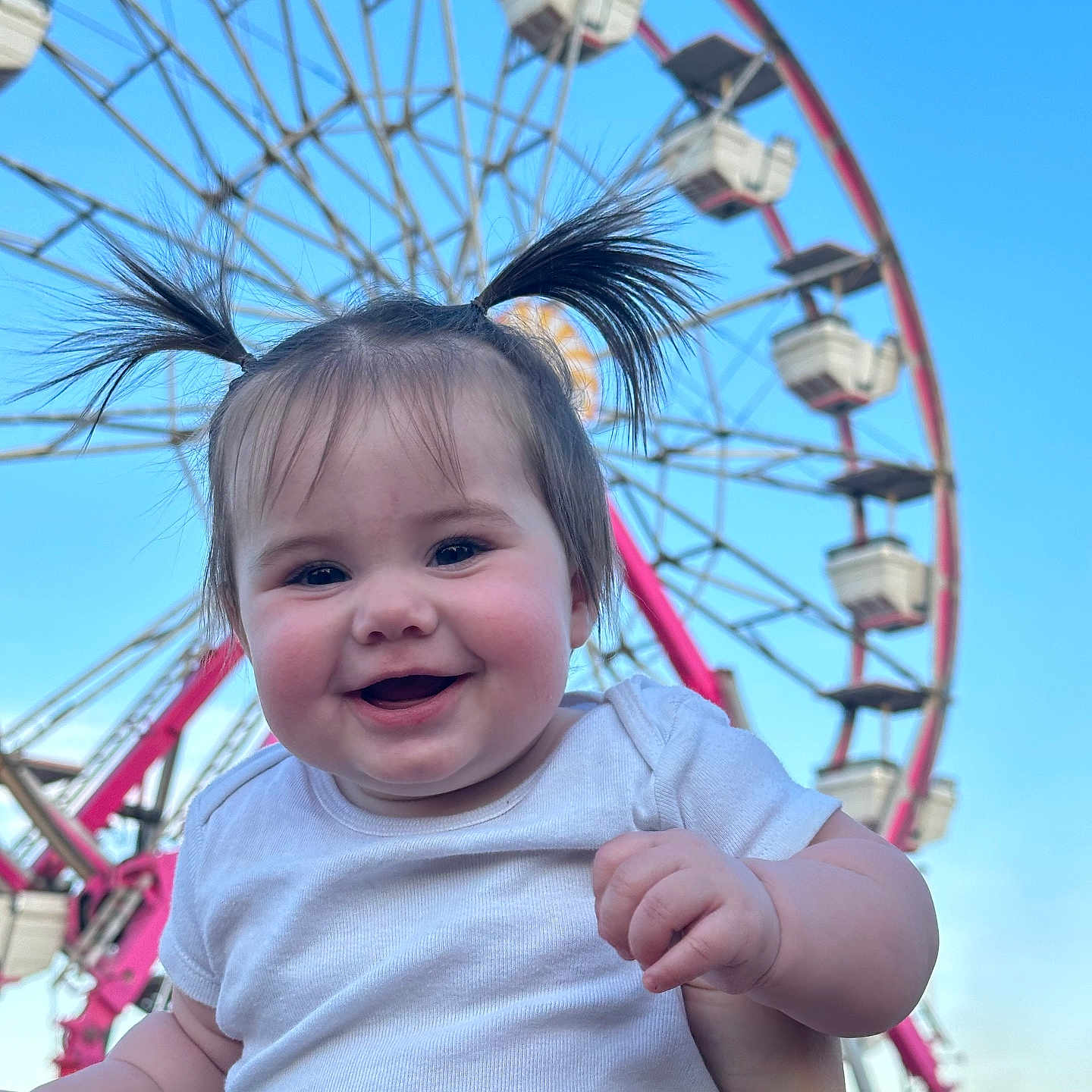 Amelia is registered to the contest to win money with this photo: amusementpark, baby, bodypart, carnival, face, ferriswheel, finger, fun, hand, happy, head, machine, mouth, outdoors, person, photography, playarea, portrait, smile, wheel