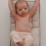 Timéo participe au concours pour gagner de l'argent avec cette photo : baby, infant, newborn, wire_basket, cushion, stretching, arms_up, fuzzy_pants, neutral_colors, portrait, soft_lighting, cozy, relaxed, cute, bare_chest, small_feet, indoors, sleepwear, resting, child