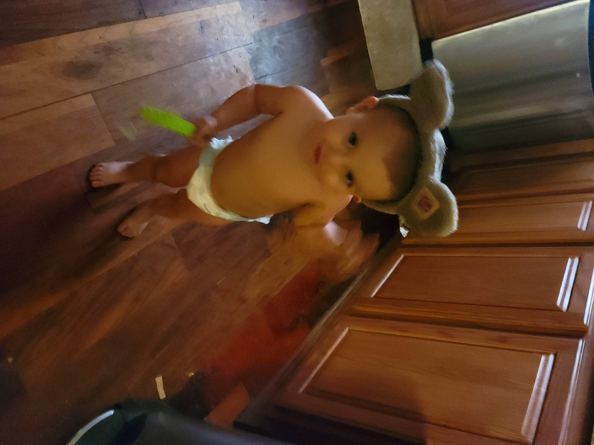 C.j. is registered to the contest to win money with this photo: abdomen, chest, comfort, elbow, fawn, floor, flooring, foot, hardwood, hip, human_leg, knee, laminate_flooring, navel, person, stuffed_toy, thigh, thumb, toy, trunk