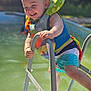 Cash joined the competition — help win amazing prizes! toddler, child, smiling, life_vest, pool, water, ladder, swimwear, outdoor, summer, sunlight, happy, playful, baby, person, swimming_pool, fun, safety, daylight, climbing