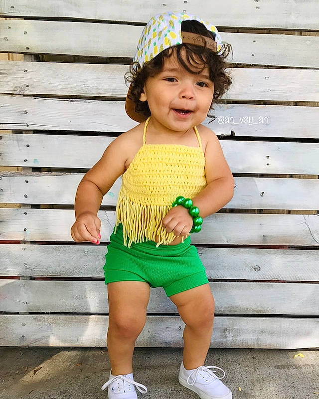 Avaya joined the competition — help win amazing prizes! baby, baby_bloomers, baby_products, baby_toddler_clothing, child, child_model, clothing, fashion_accessory, green, hair_accessory, headgear, pattern, person, play, ruffle, shorts, sportswear, toddler, waist, yellow