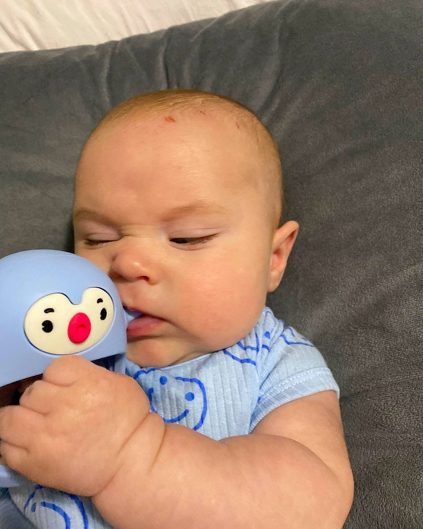 Lucca is registered to the contest to win money with this photo: baby, baby_playing_with_toys, baby_products, baby_sleeping, baby_toddler_clothing, cheek, child, comfort, ear, facial_expression, finger, fun, happy, iris, nose, person, play, skin, stuffed_toy, thumb