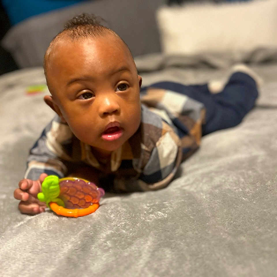 Logan joined the competition — help win amazing prizes! baby, babycrawling, biting, blanket, crawling, face, happy, head, person, photography, portrait, sitting, smile, toy