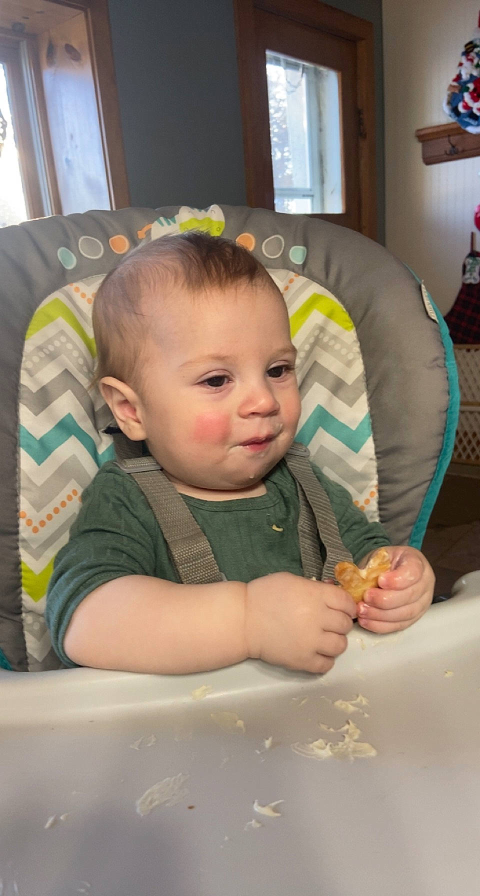 Maverick is registered to the contest to win money with this photo: baby, baby_toddler_clothing, cheek, child, curtain, drinkware, facial_expression, finger, flooring, fun, hairstyle, happy, head, iris, person, room, sitting, skin, smile, toddler