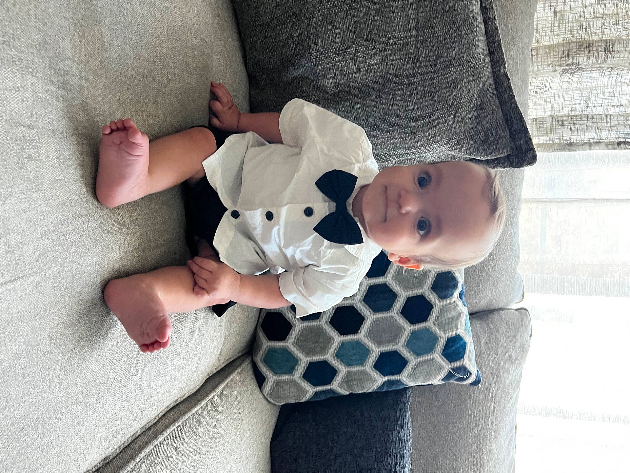 Cooper is registered to the contest to win money with this photo: baby, baby_products, baby_toddler_clothing, beauty, child, comfort, hand, head, human_body, joy, linens, mammal, pattern, person, product, room, sitting, sleeve, sock, textile