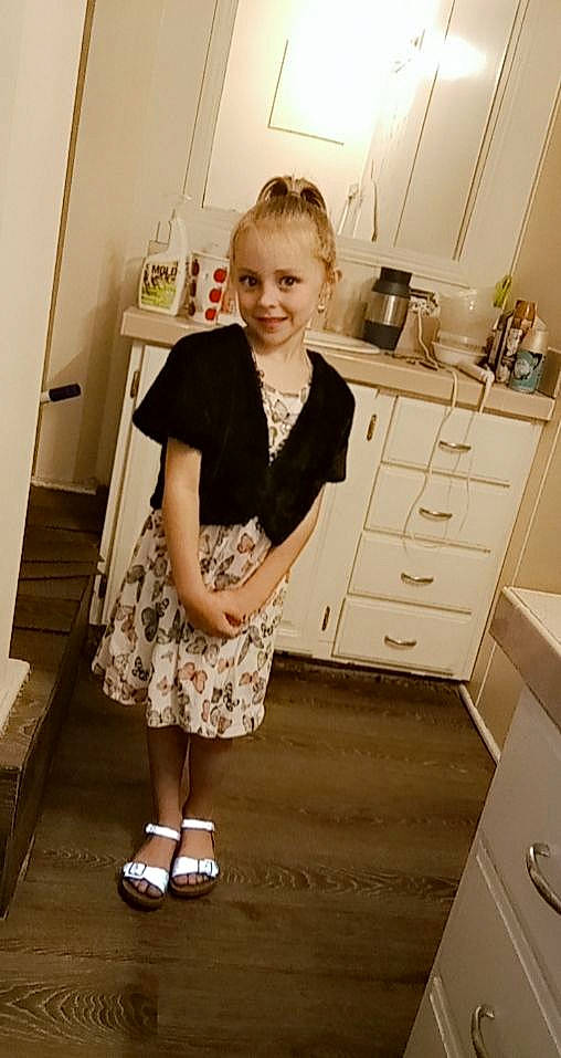 Annalee is registered to the contest to win money with this photo: cabinetry, chest_of_drawers, countertop, drawer, fashion_design, floor, flooring, hairstyle, hardwood, homemaker, human_body, human_leg, joy, kitchen, knee, person, sleeve, smile, sunglasses, trunk